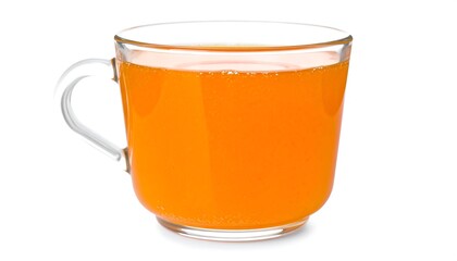 Orange juice in a clear glass mug