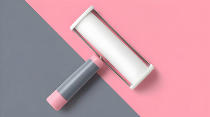 Fototapeta premium Lint roller on pink and gray background