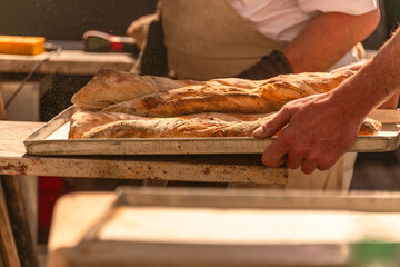 Taking Out The Bread From The Oven