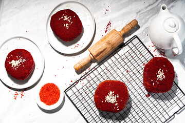 Delicious red velvet donuts on a white table. Red velvet doughnuts topped with cheese.