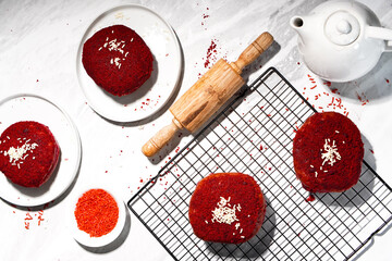 Delicious red velvet donuts on a white table. Red velvet doughnuts topped with cheese.