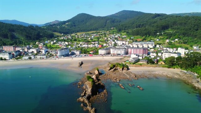Covas beach embraces the picturesque town of viveiro in galicia