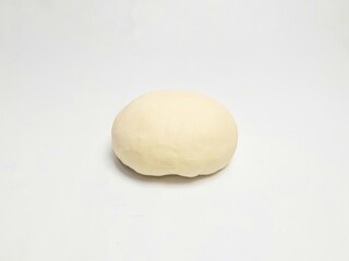 Raw dough ball on a white background, perfect for baking preparation, food blog visuals, or culinary stock images
