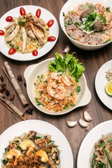 popular traditional vietnamese food dishes on restaurant table in vietnam