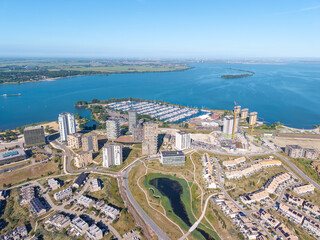 Aerial view of waterfront skyline, marina and high-rise housing