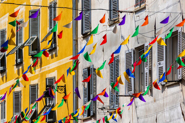 Colorful party flags between buildings in historic Ajaccio old town France, Corsica, Ajaccio, 13...