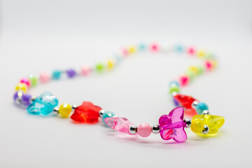 Colorful necklace with butterflies and beads. The necklace is made of glass and is very colorful.