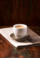 Cup of coffee on wooden background. Soft focus. Copy space	