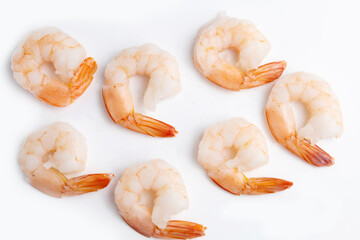 Shrimp arranged on a white surface showcasing their fresh and appetizing appearance