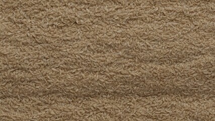 Textured closeup of rough brown fabric surface with natural fibrous details for background use