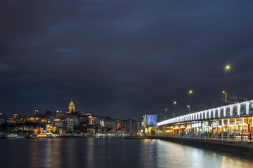 Galata Bridge, at night. ⁦This bridge ⁩⁦spans the Golden Horn, connecting the old city with Beyoglu⁩⁦, the northern district of Istanbul.⁩ The city lights are reflected in the Bosphorus