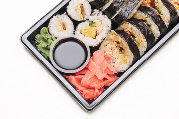 Takeaway sushi tray isolated. Traditional Japanese meal with rolls. Rice with seaweed and soy...
