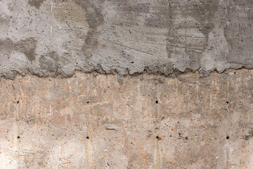 Rough dry composite concrete wall texture under construction in daylight