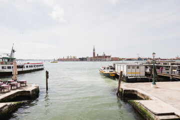 Exploring Venice's peaceful waters with boats by historic sites