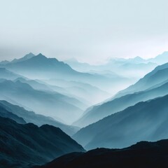 Fototapeta premium Serene Misty Mountains Landscape with Layered Blue Tones