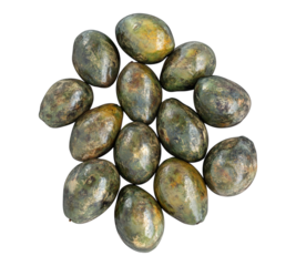 A bunch of green avocados are piled on top of each other