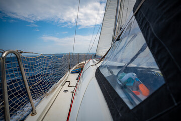 Sailing yacht moving at full speed with all sails up in the open sea near Croatia. Dynamic maritime adventure and freedom of ocean travel.