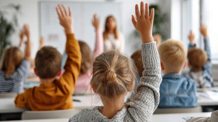 Children in a classroom eagerly raise their hands to answer a question, with a teacher in the background leading the lesson.