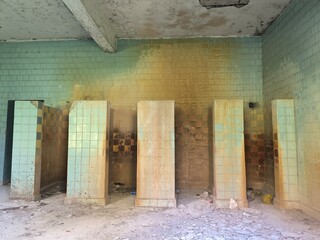 Dilapidated tiled restroom