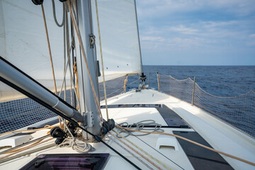 Sailing yacht moving at full speed with all sails up in the open sea near Croatia. Dynamic maritime adventure and freedom of ocean travel.