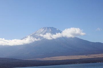 Beneath the blue sky, Fuji whispers timeless peace.