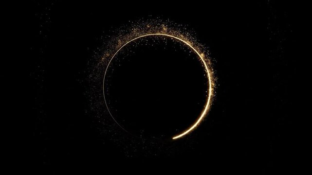 Glowing circle shape on black with gold dust