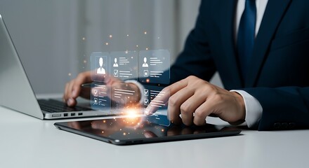 Businessman interacting with a futuristic holographic interface displaying employee profiles and performance data on a tablet and laptop for human resources and recruitment