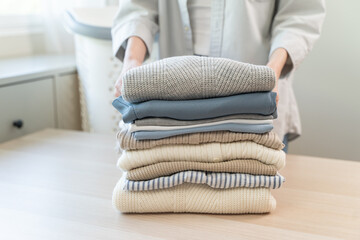 Housewife folding laundry clothes prepare before put in closet