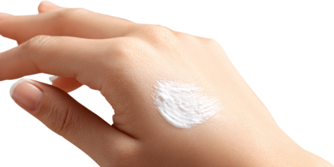 Closeup of fairskinned adult womans hand applying moisturizing cream for skincare and beauty treatment, promoting healthy skin and selfcare routine