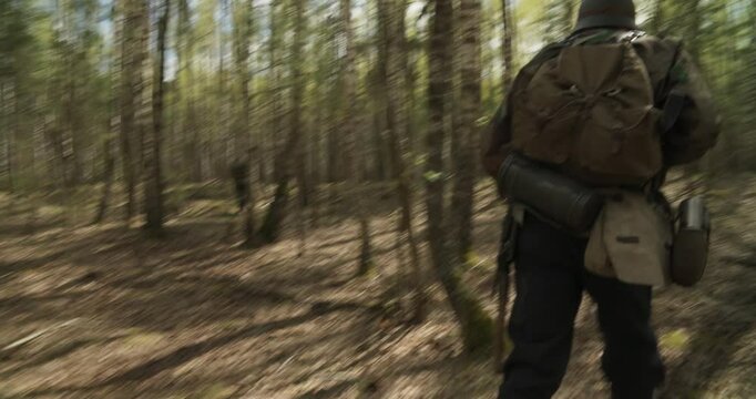 Reenactors Dressed As German Infantry Soldiers Make War Ambush In Autumn Forest. Running For Group Of Soldiers With Carabines Mauser 98k, Sub-machine Gun In Forest. Wermacht Military Uniform
