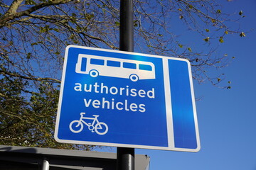 Authorised Vehicles signpost on road used by buses and cycles only.