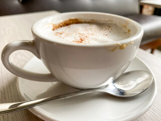 Creamy Cappuccino on Wooden Table