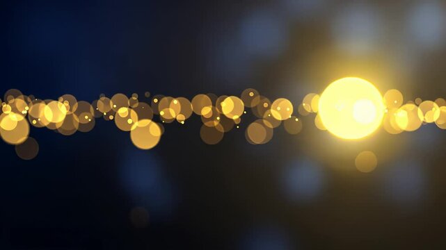 Golden bokeh lights gradually intensify against a dark background