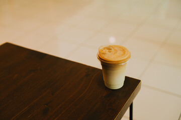 coffee in cafe. Aesthetic Coffee Cup on Wooden Table in Bright Modern Setting with Minimalist Design and Soft Lighting