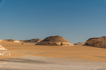 White rock formations and sand dunes in Egypt's White Desert, natural desert landscape	