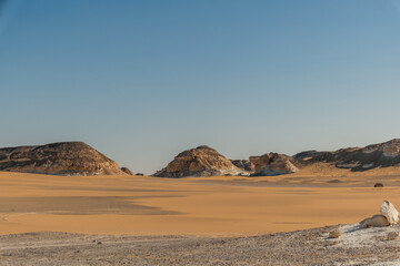 White rock formations and sand dunes in Egypt's White Desert, natural desert landscape	
