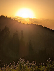 A hike up Gadrekili Hill near Bakhmaro, Georgia, July. Sunset in mountains.