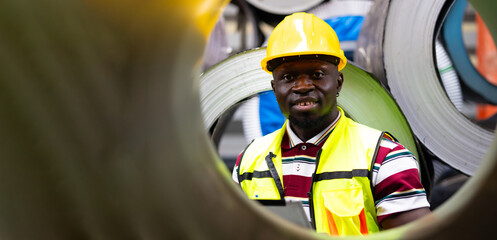 Steel Rolls in Steel Mill. African Professional Mechanical Engineer factory employees checking...
