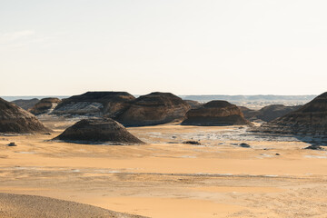 White rock formations and sand dunes in Egypt's White Desert, natural desert landscape	