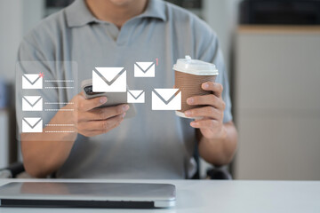Email notification concept, Male use smartphone and laptop receive message alert in the mailbox.