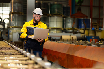 Laptop computer : blue collar working production line : Caucasian man engineer worker working...