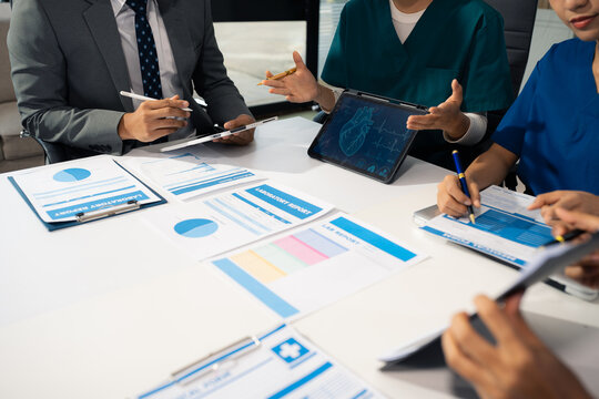 Medical team working on digital tablet healthcare doctor technology tablet using computer analyzed the results of medical reports at the hospital.