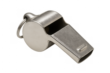 Metal whiskey referee whistle lying on clear surface, signaling readiness for sports coaching and competitive gameplay