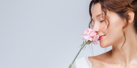 Beauty Banner With Woman Holding Pink Flower And Relaxed Peaceful Expression