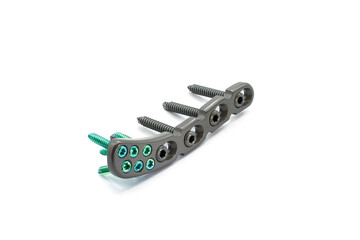 Distal Clavicle surgical plate with screw on a white background. a plate is used for fixation of...