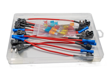 A fuse tap kit with red wires, blue connectors, and assorted blade fuses. The components are...