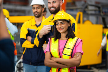 Obraz premium arm crossed Unity and teamwork. Asian indian Engineering and civil factory standing. Portrait engineer factory manager worker and mechanic team together at metal sheet profiling factory. Industrial