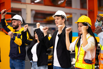 Celebrate Raise hand up. Unity and teamwork. Ethnic diversity engineering team standing together....