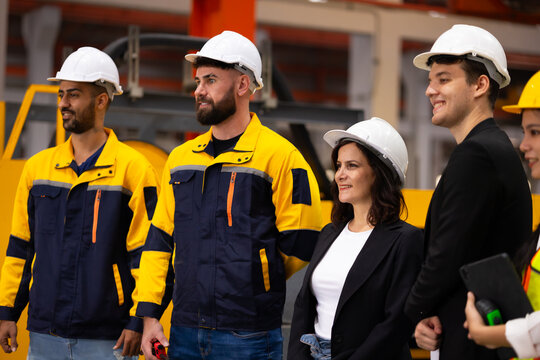 Ethnic diversity worker people, Success teamwork. Group of professional engineering people wearing hardhat safety helmet meeting. Communication Morning Brief. metal sheet profiling factory - Powered by Adobe