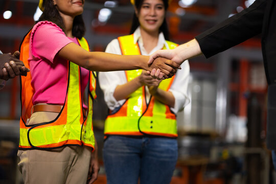 shaking hands agreement : Ethnic diversity worker, Success teamwork. Asian indian woman professional engineering wearing hardhat safety helmet meeting. Communication metal sheet profiling factory